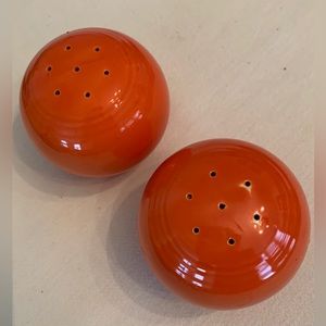Vintage Fiestaware original red salt and pepper shakers.